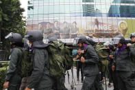 Police arrive outside the German Embassy in central Bangkok, Thailand, Monday, Oct. 26, 2020. Thai royalists gathered outside the embassy to defend pro-democracy protesters' contention that King Maha Vajiralongkorn spends much of his time in Germany conducting Thai political activities. German government officials have recently expressed concern over political activities the king might be conducting on the Germany's soil. (AP Photo/Gemunu Amarasinghe)