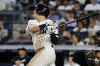 New York Yankees' Gio Urshela follows through on a two-run home run during the fifth inning of the team's baseball game against the Houston Astros on Saturday, June 22, 2019, in New York. (AP Photo/Frank Franklin II)