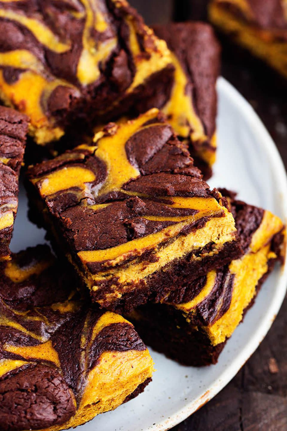 <p>You get the best of both worlds with this decadent dessert. </p><p><strong>Get the recipe at <a href="https://therecipecritic.com/2015/10/pumpkin-cheesecake-brownies/" rel="nofollow noopener" target="_blank" data-ylk="slk:The Recipe Critic;elm:context_link;itc:0;sec:content-canvas" class="link ">The Recipe Critic</a>. </strong></p>