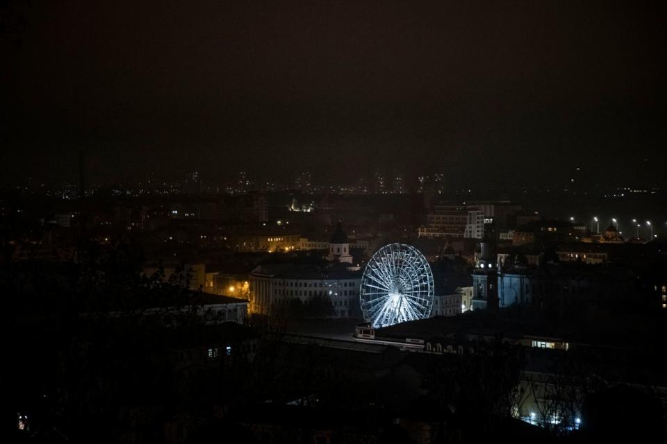 A ferris wheel is lit as sporadic power cuts leave parts of the city in darkness on Nov. 5, 2022 in Kyiv. (Ed Ram/Getty Images)