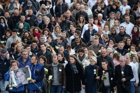 Relatives take part in a silent march - Credit:  SEBASTIEN BOZON/SEBASTIEN BOZON/AFP/Getty Images