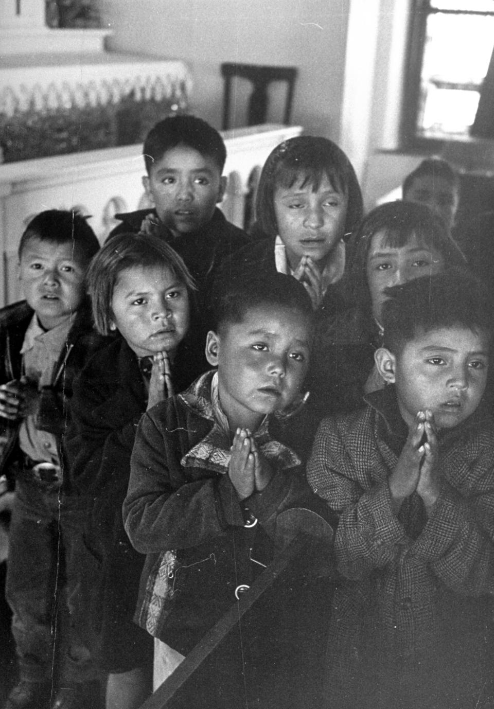 Navajo children receiving religious instructions.