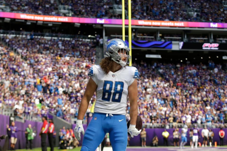 Lions tight end T.J. Hockenson (88) celebrates after catching a 5-yard touchdown pass during the first half against the Vikings, Sunday, Sept. 25, 2022, in Minneapolis.