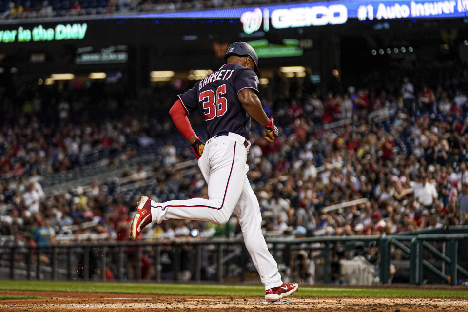 Washington Nationals' Stone Garrett crosses home plate after hitting a solo home run during the fourth inning of the team's baseball game against the Boston Red Sox at Nationals Park, Wednesday, Aug. 16, 2023, in Washington. (AP Photo/Andrew Harnik)