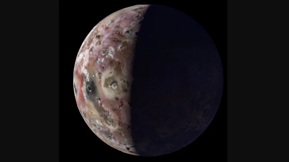 a close-up view of jupiter's volcanic moon io against the blackness of space