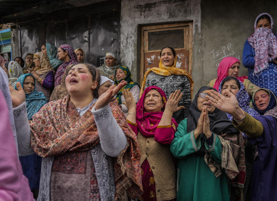 Family members and relatives cry after a boat carrying people including children capsized in Jhelum river on the outskirts of Srinagar, Indian controlled Kashmir, Tuesday, April. 16, 2024. Rescue operation is continuing for the several missing people. (AP Photo/Mukhtar Khan)