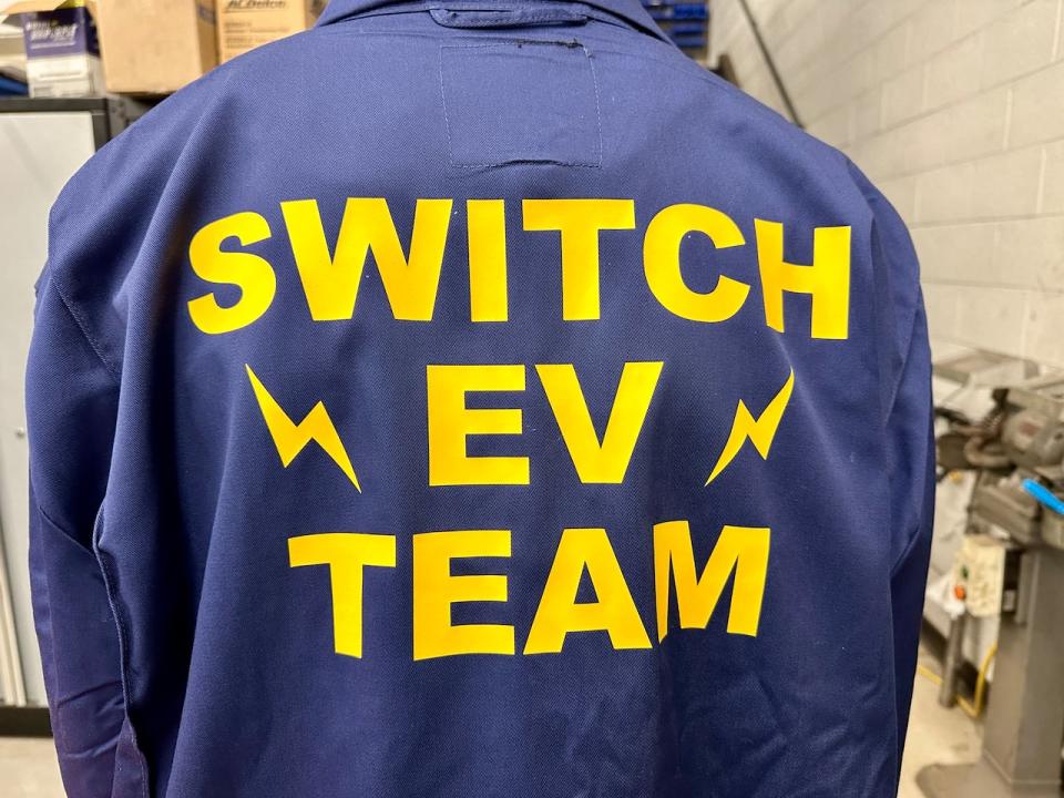 The logo on the coveralls of students in the automotive class at St. Anne Catholic High School in Lakeshore. Photographed Dec. 14, 2023.