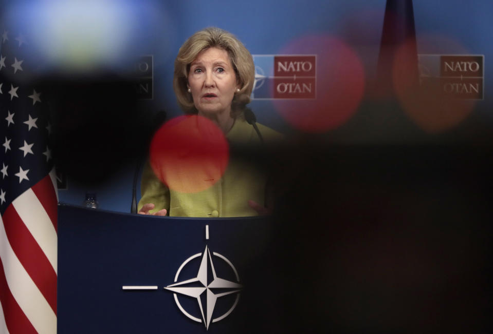 United States Ambassador to NATO Kay Bailey Hutchison walks to the podium prior to a media conference at NATO headquarters in Brussels, Tuesday, June 25, 2019. (AP Photo/Virginia Mayo)