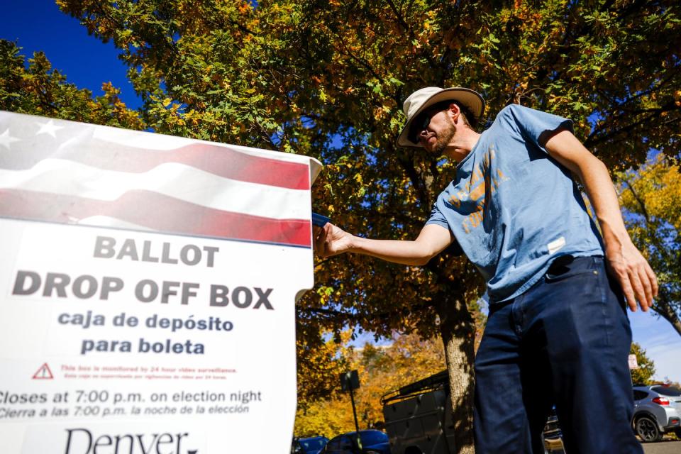 The Colorado Supreme Court said Donald Trump could not appear on the state’s 2024 primary or general election ballot. Here, a voter drops off his ballot in Denver during the 2022 election. <a href="https://www.gettyimages.com/detail/news-photo/voter-places-his-ballot-in-a-drop-off-box-outside-the-la-news-photo/1244617819?adppopup=true" rel="nofollow noopener" target="_blank" data-ylk="slk:Photo by Michael Ciaglo/Getty Images;elm:context_link;itc:0;sec:content-canvas" class="link ">Photo by Michael Ciaglo/Getty Images</a>