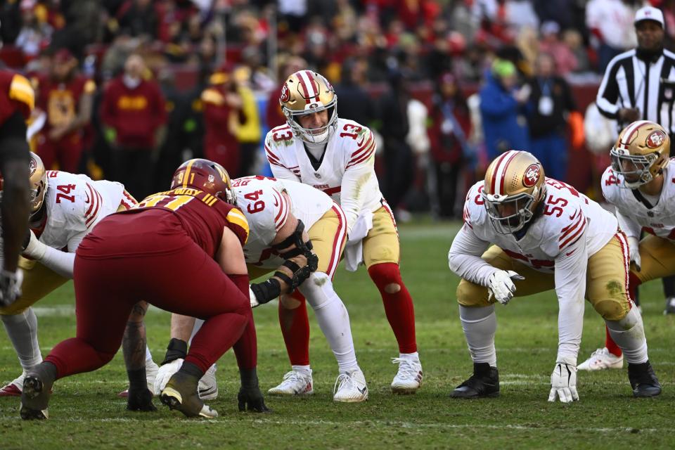 Dec 31, 2023; Landover, Maryland, USA; San Francisco 49ers quarterback Brock Purdy (13) at the line of scrimmage against the Washington Commanders during the second half at FedExField. Mandatory Credit: Brad Mills-USA TODAY Sports