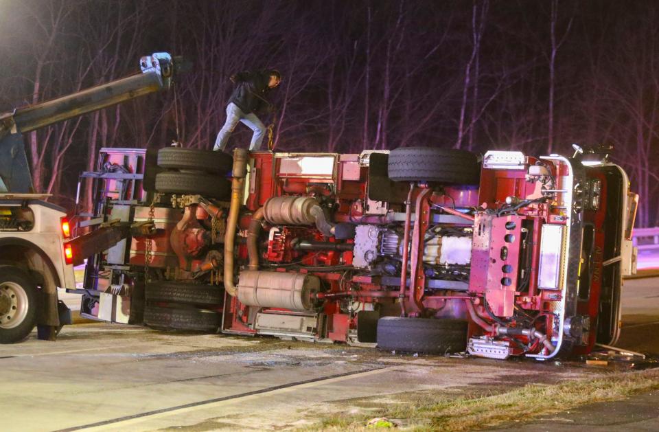 An Aetna Hose, Hook and Ladder Company fire engine rests on its side after overturning on eastbound Christina Parkway at Elkton Road about 10:35 pm, Friday, Feb. 9, 2024.