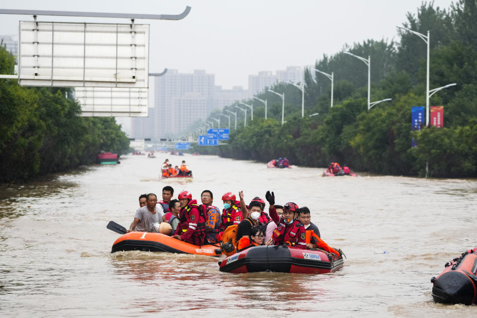 Residents evacuate on rubber boats through floodwaters in Zhuozhou in northern China's Hebei province, south of Beijing, Wednesday, Aug. 2, 2023. China's capital has recorded its heaviest rainfall in at least 140 years over the past few days. Among the hardest hit areas is Zhuozhou, a small city that borders Beijing's southwest. (AP Photo/Andy Wong)