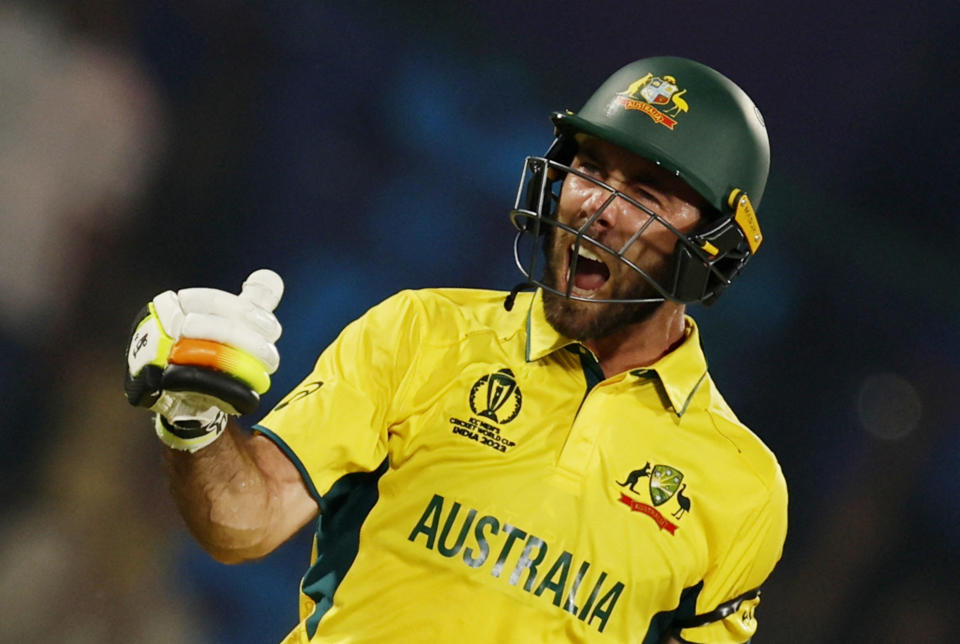 Australia's Glenn Maxwell celebrates after reaching his century in just 40 balls - a new ICC Men's Cricket World Cup record - against the Netherlands in Delhi (Reuters)