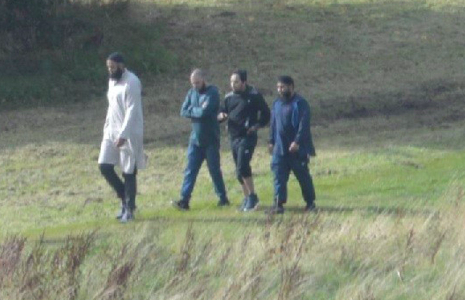 <em>Naweed Ali, Tahir Aziz, Mohibur Rahman and Khobaib Hussain walking in the park at Bank Hall Road five days before their arrest (PA)</em>