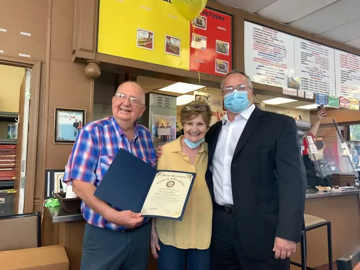 Ken Reimer, his wife, Pat, and Illinois State Sen. John Connor as Connor presents the retiring owners of the Chicken-N-Spice with a state recognition reward. (John Ferak/Patch)