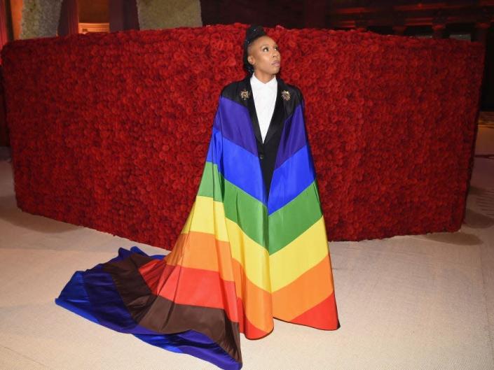 Lena Waithe at the Met Gala in 2018 wearing a rainbow cape