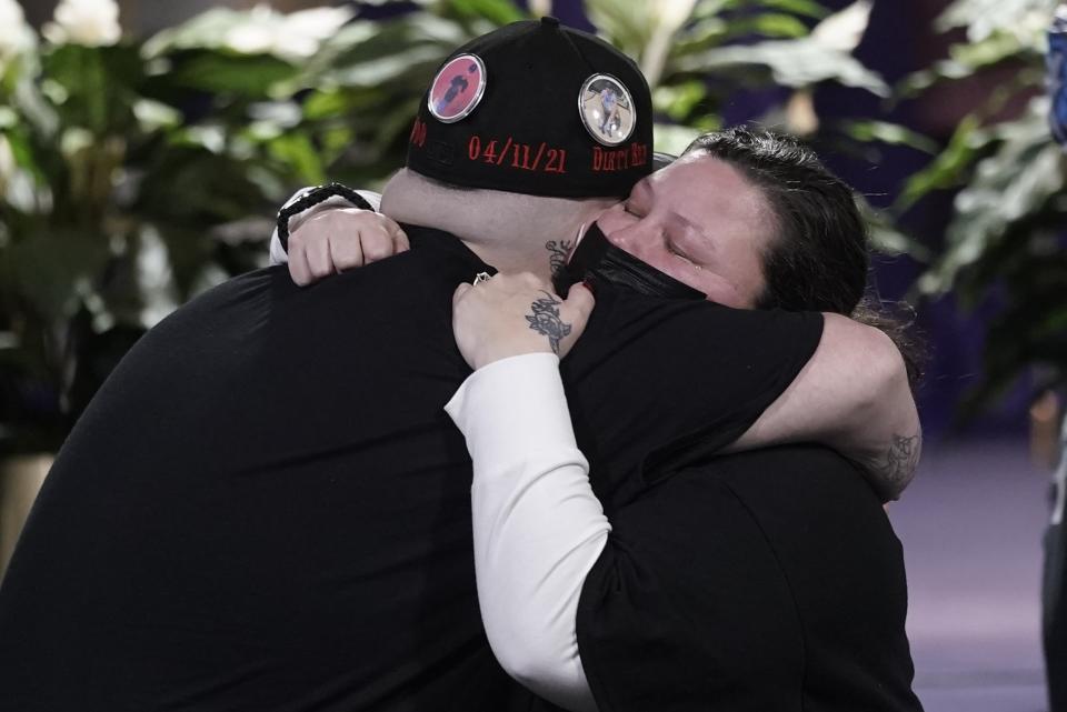 Katie Wright, mother of Daunte Wright, hugs Daunte's brother Damik Bryant during a visitation, Wednesday, April 21, 2021, in Minneapolis. Daunte Wright was fatally shot by a police officer during a traffic stop. (AP Photo/Morry Gash)