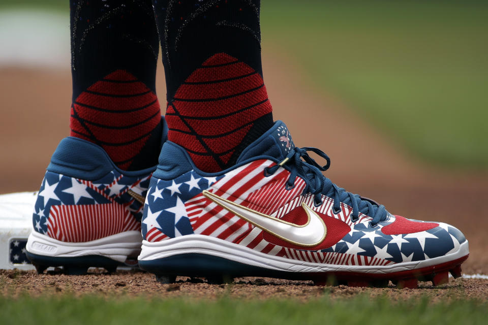 Chicago Cubs' Anthony Rizzo wears shoes with a Stars and Stripes theme as he stands on third base during the first inning of the team's baseball game against the Pittsburgh Pirates in Pittsburgh, Thursday, July 4, 2019. (AP Photo/Gene J. Puskar)