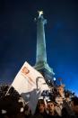 Supporters of France's Socialist Party (PS) newly elected president Francois Hollande celebrate at the Bastille Square in Paris after the announcement of the results of the French presidential final round