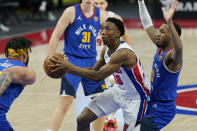 Detroit Pistons guard Saben Lee (38) passes as Denver Nuggets center JaVale McGee, left, defends during the second half of an NBA basketball game, Friday, May 14, 2021, in Detroit. (AP Photo/Carlos Osorio)