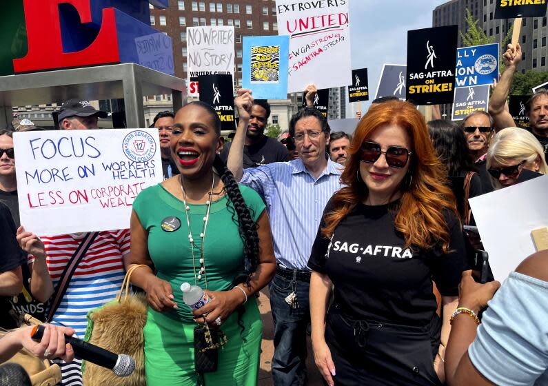 Actors Sheryl Lee Ralph, left, and Lisa Ann Walter, members of the cast of "Abbott Elementary," participate in a rally