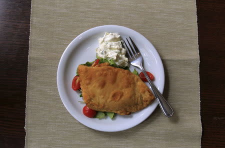 "Bolani" with fresh "laban", also known as Afghan pie with Syrian cream cheese, is served in the Manga Cowboy restaurant in Budapest, Hungary, September 29, 2015. REUTERS/Bernadett Szabo