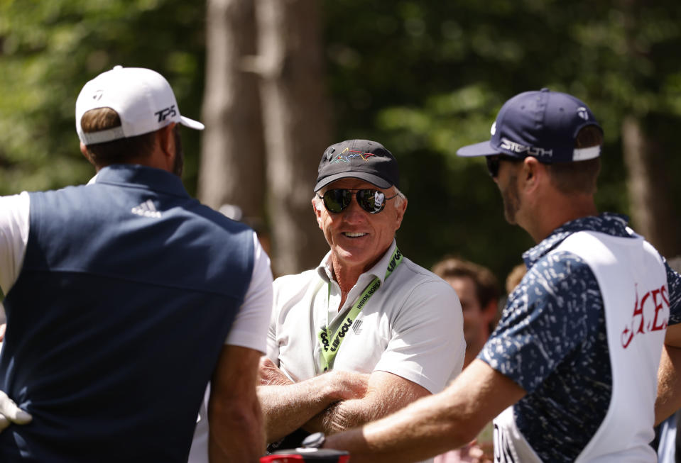 LIV Golf chief Greg Norman smiles as he stands on the course during day two of the LIV Golf Invitational Series at the Centurion Club, St. Albans, England, Friday June 10, 2022. The Saudi-funded golf breakaway entered it's second day Friday in a course just outside of London. (Steven Paston/PA via AP)