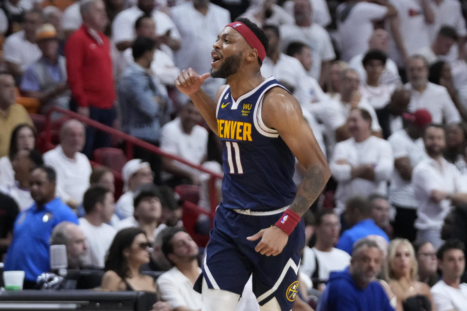 Denver Nuggets forward Bruce Brown (11) celebrates during the second half of Game 4 of the basketball NBA Finals against the Miami Heat, Friday, June 9, 2023, in Miami. (AP Photo/Wilfredo Lee)