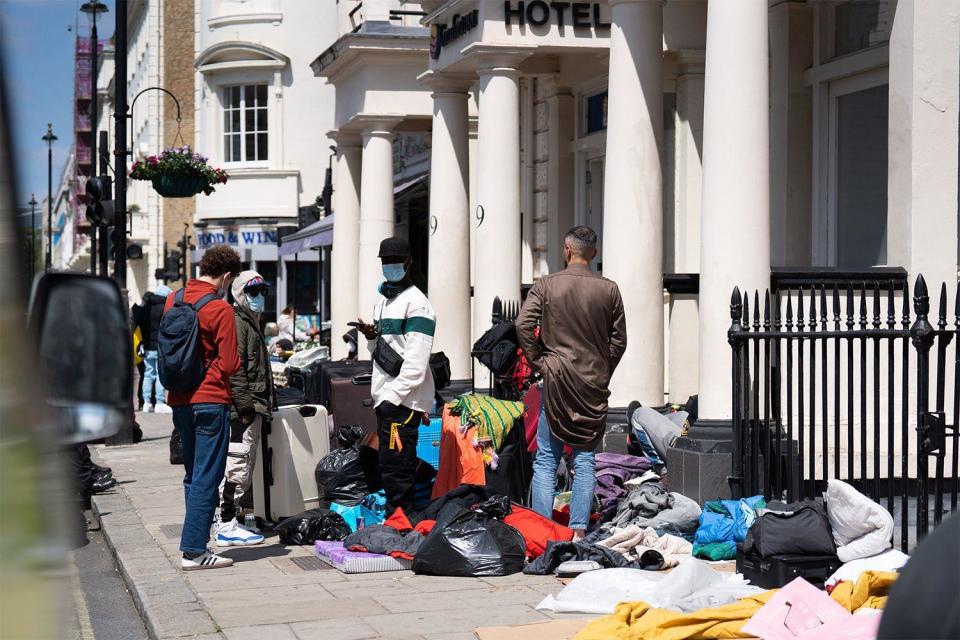 Migrants outside a hotel in Pimlico, London