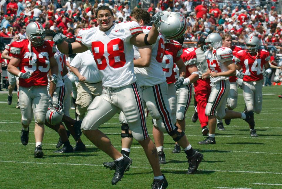 (NCL OSU FOOTBALL LAURON 24APR04) Gray's Louis Irizarry, 88, pumps up the crowd as he and his teammates leave the field for half time at the Scarlet and Gray game at Ohio Stadium, April 24, 2004. (Dispatch photo by Neal C. Lauron)