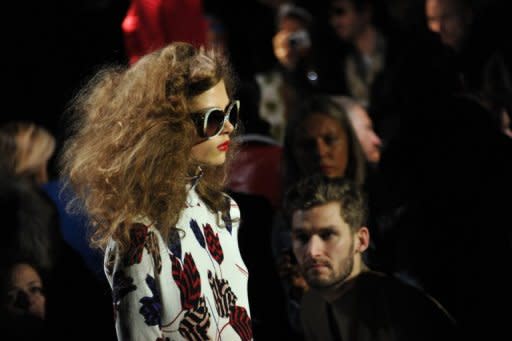 A model walks the runway at the Marc by Marc Jacobs Fall 2013 fashion show, on February 11, 2013, in New York. Colors at New York Fashion Week have often seemed tuned to the stormy weather outside, but Jacobs is among those who've decided to bring sunshine -- even if only onto the catwalk