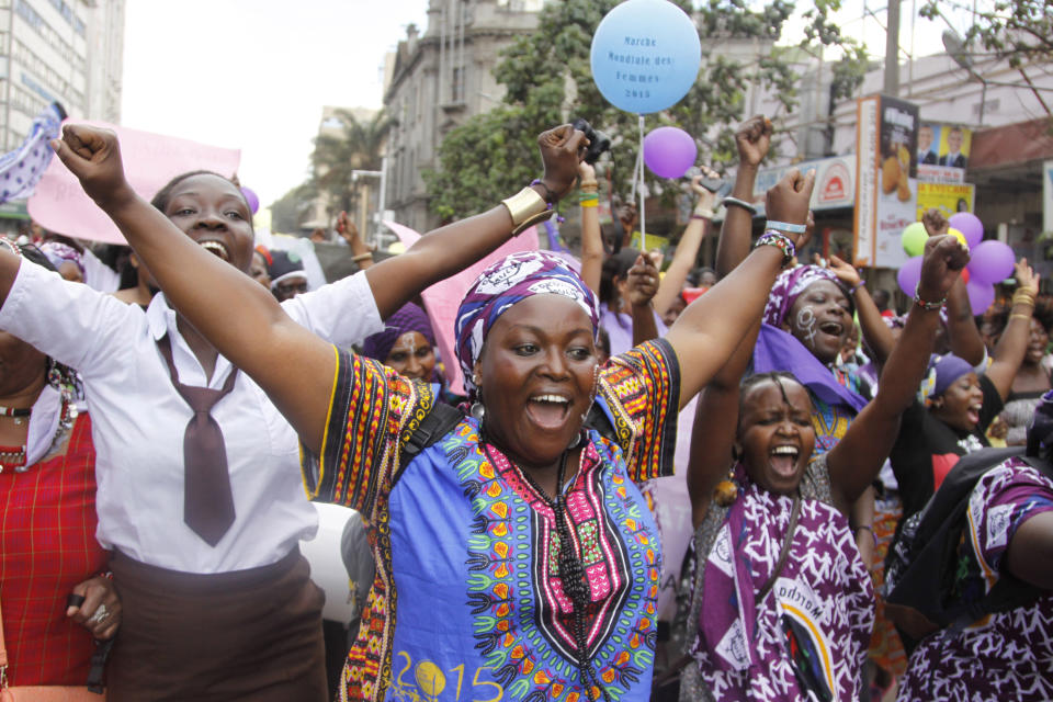 FILE - In this Oct. 13, 2015 file photo, women from Kenya, Uganda, Tanzania, Rwanda and Burundi participate in the world march of woman in Nairobi, Kenya. The World Health Organization says the practice constitutes an "extreme form of discrimination" against women. Nearly always carried out on minors, it can result in excessive bleeding and death or cause problems including infections, complications in childbirth and depression. (AP Photo/Khalil Senosi, File)