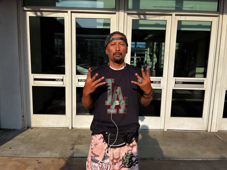 Jorge Preciado poses for a photo at King/Drew High School before a Drew League basketball game.