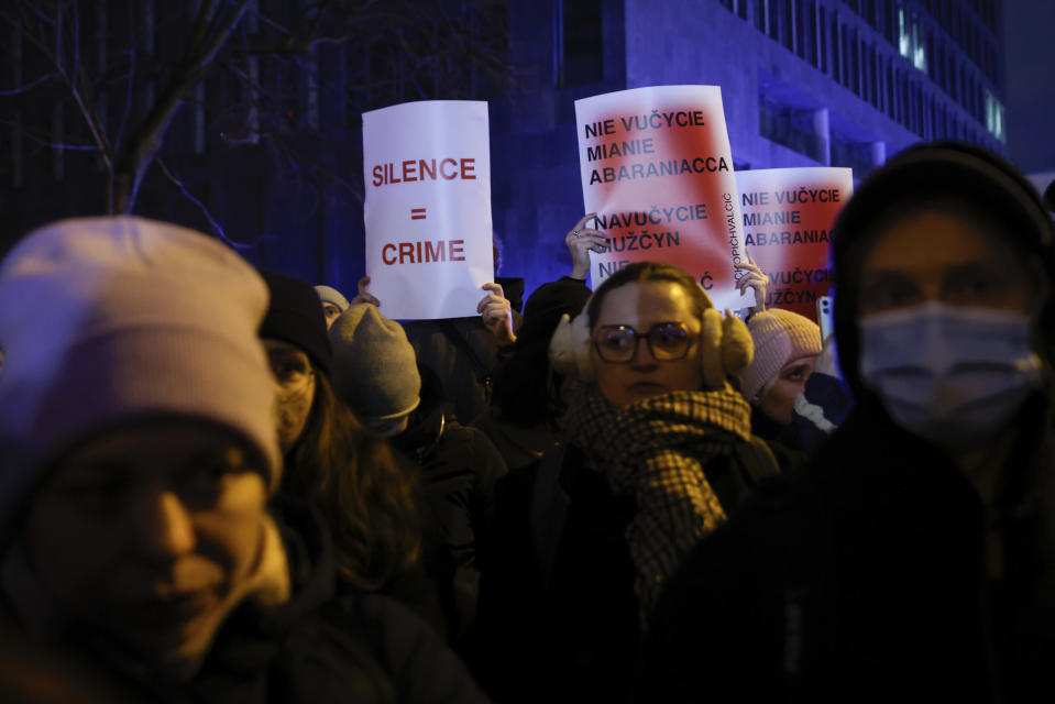 People march in silence to commemorate Lizaveta, a 25-year-old Belarusian woman who died after a being brutally attacked and raped on the streets of Warsaw last month, in Warsaw Poland, Wednesday, March 6, 2024. The crime has shocked people across Poland. Poles, Belarusians and Ukrainians gathered at the site of the crime in downtown Warsaw, placing flowers and lighting candles in honor of the woman known only as Lizaveta, or Liza. (AP Photo/Michal Dyjuk)