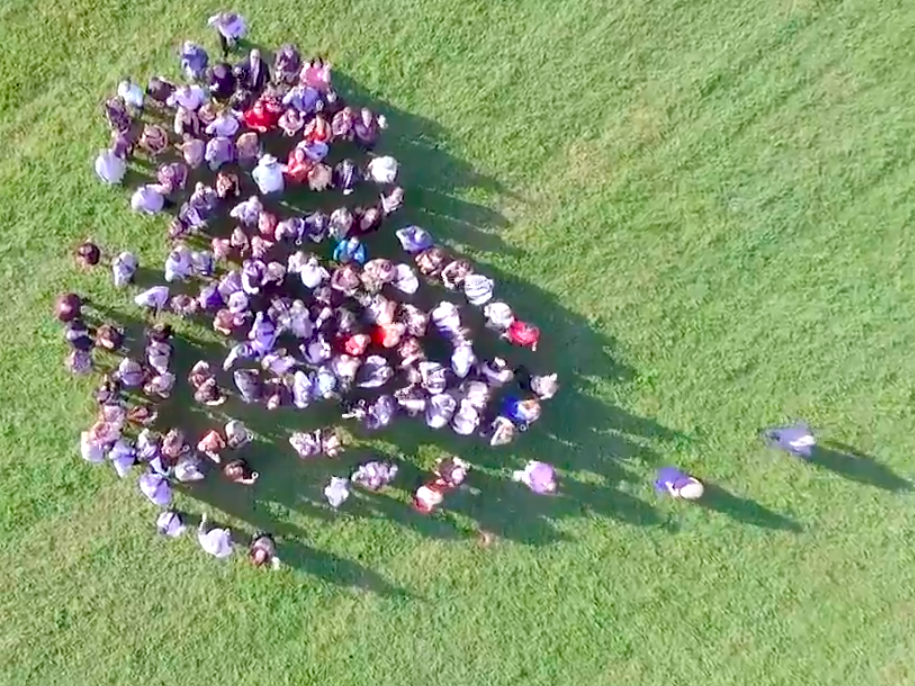 The group then gathered together in the middle of the field to surround the couple. Source: Mack Evenden/Evendenimaging.ca