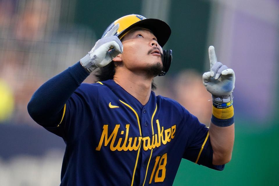 Milwaukee Brewers' Keston Hiura celebrates as he crosses home plate after hitting a solo home run off Pittsburgh Pirates starting pitcher Roansy Contreras during the second inning of a baseball game in Pittsburgh, Friday, July 1, 2022. (AP Photo/Gene J. Puskar) ORG XMIT: PAGP108