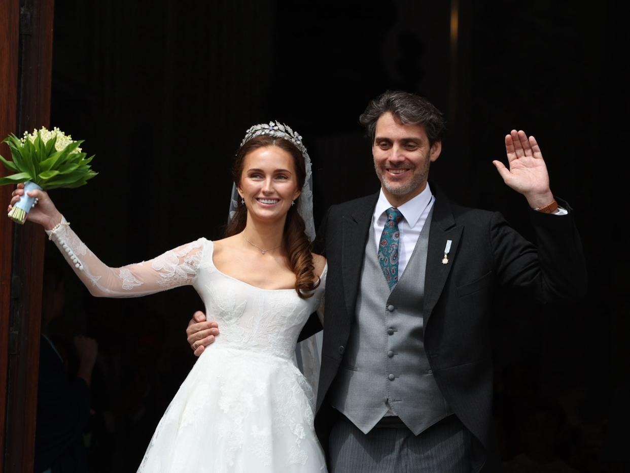 Princess Sophie and Prince Ludwig of Bavaria wave on their wedding day.