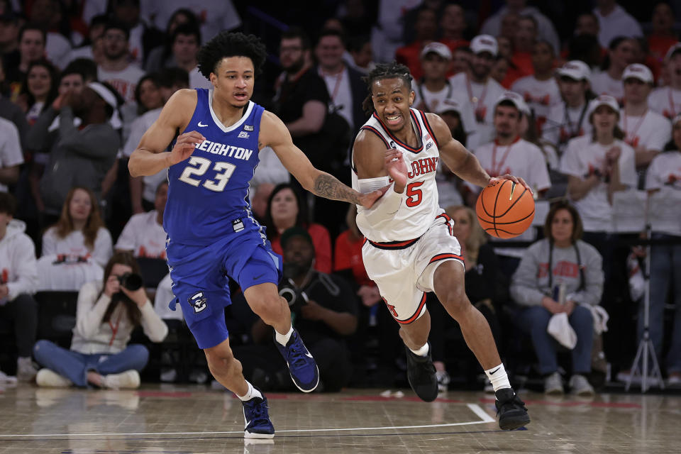 St. John's guard Daniss Jenkins (5) drives past Creighton guard Trey Alexander (23) during the second half of an NCAA college basketball game, Sunday, Feb. 25, 2024, in New York. (AP Photo/Adam Hunger)