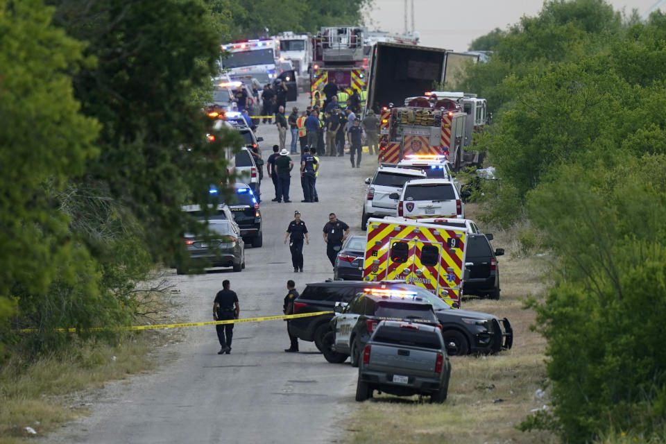 Police work the scene where dozens of people were found dead in a semitrailer in a remote area in southwestern San Antonio, Monday, June 27, 2022. (AP Photo/Eric Gay)