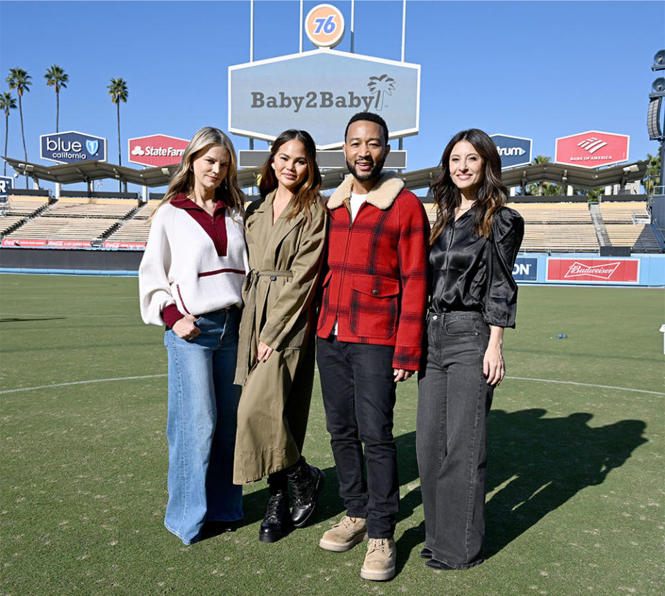 Kelly Sawyer Patricof, Co-CEO, Baby2Baby, Chrissy Teigen, John Legend and Norah Weinstein, Co-CEO, Baby2Baby, attend the 2023 Baby2Baby Holiday Distribution presented by FRAME & Nordstrom at Dodger Stadium on December 13, 2023 in Los Angeles, California.