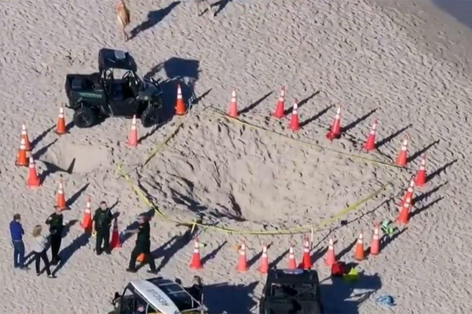 <p>CBS Miami/Youtube</p> The sink hole on the beach in Lauderdale-by-the-Sea