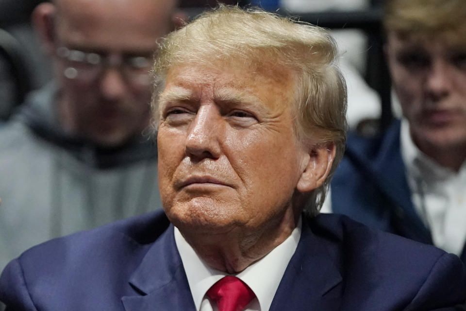 FILE - Former President Donald J. Trump watches the NCAA Wrestling Championships, Saturday, March 18, 2023, in Tulsa, Okla. Trump’s calls for protests ahead of his anticipated indictment in New York have generated mostly muted reactions from supporters, with even some of his most ardent loyalists dismissing the idea as a waste of time or a law enforcement trap. (AP Photo/Sue Ogrocki, File)