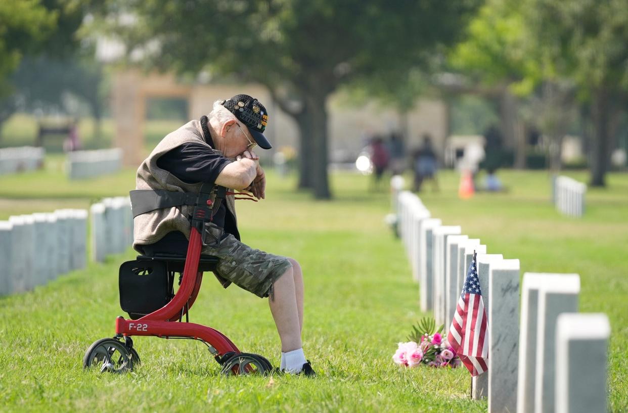 Vietnam War veteran George Van Stienburg of Lampasas visits the grave of his wife, Carol, who was also an Army veteran. (Credit: Jay Janner/American-Statesman)