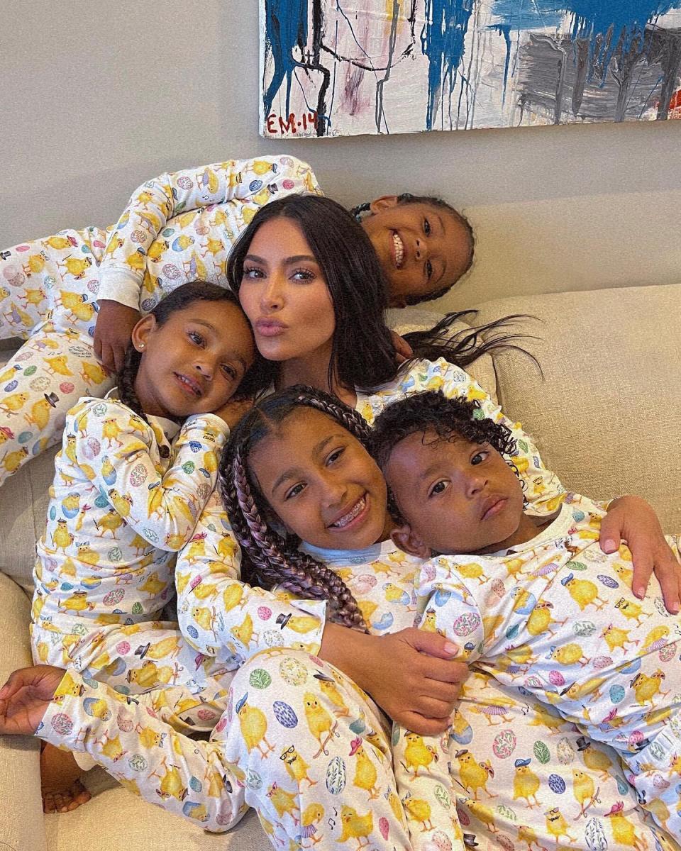 Kim Kardashian posing with her children