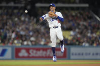 Los Angeles Dodgers shortstop Mookie Betts throws out Miami Marlins' Jazz Chisholm Jr. at first base after a ground ball during the sixth inning of a baseball game Tuesday, May 7, 2024, in Los Angeles. (AP Photo/Marcio Jose Sanchez)