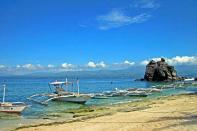 <strong>Islands off Dumaguete:</strong> Apo and Siquijor. Both islands are accessible via the seaport city of Dumaguete for some easy day trips. Apo Island (in the photo), may not be much to look at, beach-wise, but underwater is a whole different story. The marine sanctuary is considered by many divers as one of the world’s best and UK-based magazine, Sport Diver, agreed, including it their list of world’s “ultimate dive destinations” a few years back.