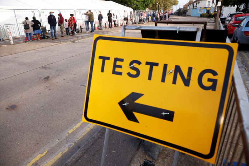 People queue outside a test centre in Southend-on-sea