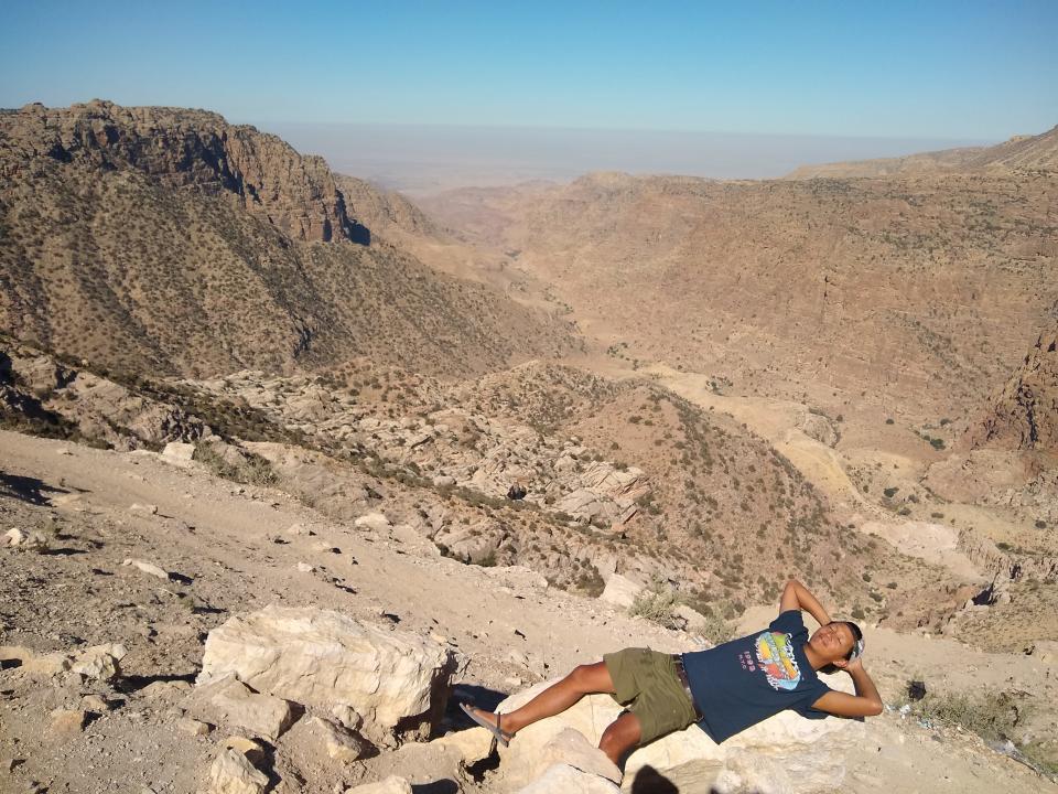 tino roco laying down on rock