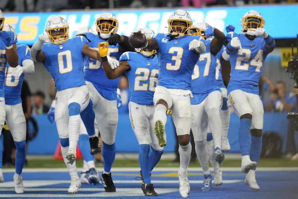 Los Angeles Chargers safety Derwin James Jr. (3) celebrates his interception with teammates during the second half of an NFL football game against the Chicago Bears, Sunday, Oct. 29, 2023, in Inglewood, Calif. (AP Photo/Ashley Landis)
