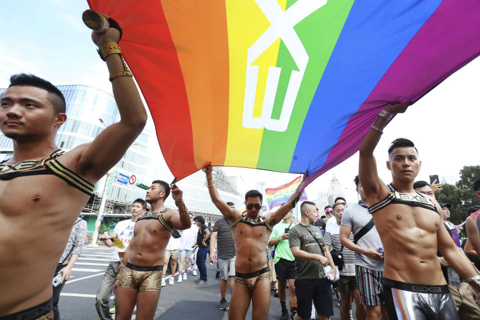 FILE - Participants revel through the streets during the annual gay pride parade in Taipei, Taiwan, Saturday, Oct. 26, 2019. Singapore’s announcement Sunday, Aug. 22, 2022, that it would decriminalize sex between men is being hailed as a step in the right direction for LGBTQ rights in the Asia-Pacific region, a vast area of nearly 5 billion people with different laws and attitudes. (AP Photo/Chiang Ying-ying, File)